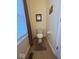 Powder room featuring a toilet and small window at 8130 Winterset Cir, Indianapolis, IN 46214