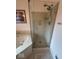 A shower with clear glass and a soaking tub at 8130 Winterset Cir, Indianapolis, IN 46214