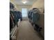 Organized walk-in closet with ample storage for clothing and accessories at 8130 Winterset Cir, Indianapolis, IN 46214