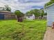 Expansive backyard showcasing a white shed and wooden fence, great for outdoor activities at 814 Walnut St, Anderson, IN 46012
