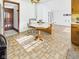 Bright kitchen with an eat-in dining area, vintage cabinets and flooring at 814 Walnut St, Anderson, IN 46012