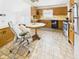Traditional kitchen featuring wood cabinetry, a breakfast nook and vintage tile flooring at 814 Walnut St, Anderson, IN 46012