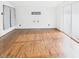 Bright living room with wood floors, sliding glass doors, and light walls at 814 Walnut St, Anderson, IN 46012