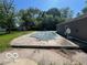 View of backyard area featuring a large, in-ground pool with cover, adjacent to the home at 825 W Auman Dr, Carmel, IN 46032