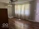 Bedroom with hardwood floors, a closet, and natural light from the window at 825 W Auman Dr, Carmel, IN 46032