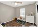 This playroom features a window, a small table, and a white dresser at 8904 Browns Valley Ln, Camby, IN 46113