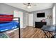 This bedroom has neutral walls, a ceiling fan, a bunk bed, and a tv at 8904 Browns Valley Ln, Camby, IN 46113