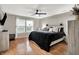 This bedroom features natural light, modern ceiling fan, and neutral walls at 8904 Browns Valley Ln, Camby, IN 46113