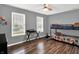 This bedroom has neutral walls, two windows, ceiling fan, and a bunk bed at 8904 Browns Valley Ln, Camby, IN 46113