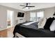 This bedroom has neutral walls, two windows, ceiling fan, and a doorway to the bathroom at 8904 Browns Valley Ln, Camby, IN 46113