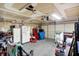 Functional garage space offering plenty of room for storage with exposed ceiling and an automatic garage door at 8904 Browns Valley Ln, Camby, IN 46113