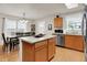 Stylish kitchen with stainless appliances, island, and a bright, open layout dining area at 8904 Browns Valley Ln, Camby, IN 46113