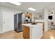 Bright kitchen featuring stainless appliances, island, and skylights with an open layout at 8904 Browns Valley Ln, Camby, IN 46113