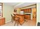 View of the basement bar with cabinets, counter space, and two stools for seating at 938 Weeping Way Ln, Avon, IN 46123