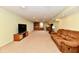 Finished basement featuring carpeting, bar area, and a TV viewing area at 938 Weeping Way Ln, Avon, IN 46123