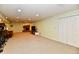 Spacious finished basement with carpet floors, white doors, fireplace and a television at 938 Weeping Way Ln, Avon, IN 46123