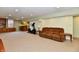 Finished basement featuring carpeting, bar area, and exercise equipment at 938 Weeping Way Ln, Avon, IN 46123