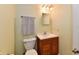 Small bathroom has a single sink vanity with a square mirror and white walls at 938 Weeping Way Ln, Avon, IN 46123