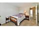 Bedroom featuring neutral walls, carpet flooring, a bed with a patterned bedspread, and bedside tables at 938 Weeping Way Ln, Avon, IN 46123