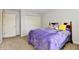 Bedroom featuring neutral walls, carpet flooring, and a bed with a purple bedspread at 938 Weeping Way Ln, Avon, IN 46123