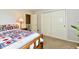 Bedroom featuring neutral walls, carpet flooring, a bed with a patterned bedspread, and closet at 938 Weeping Way Ln, Avon, IN 46123