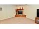 Basement corner fireplace with a wood mantle and dark hearth at 938 Weeping Way Ln, Avon, IN 46123