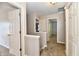 Upstairs hallway with multiple doors, offering access to various rooms at 938 Weeping Way Ln, Avon, IN 46123