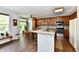 Bright kitchen featuring wood cabinets, stainless steel appliances, granite countertops, and an adjacent dining area at 938 Weeping Way Ln, Avon, IN 46123
