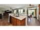 Open kitchen with granite countertops, wooden cabinets, stainless sink and fixtures, in a well lit space at 938 Weeping Way Ln, Avon, IN 46123