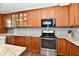 Updated kitchen featuring granite countertops, wood cabinets and stainless steel appliances at 938 Weeping Way Ln, Avon, IN 46123