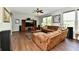 Spacious living room with hardwood floors, a ceiling fan, and plenty of natural light at 938 Weeping Way Ln, Avon, IN 46123