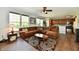 Open floor plan showcases the living room, with wood floors, leading into the updated kitchen at 938 Weeping Way Ln, Avon, IN 46123