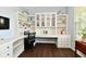 Well-lit office boasts ample storage with custom cabinets and an ergonomic workspace at 938 Weeping Way Ln, Avon, IN 46123