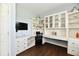 Bright office space featuring custom built-ins, a comfortable desk area, and stylish decor at 938 Weeping Way Ln, Avon, IN 46123