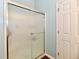 Shower stall enclosed with glass door and a white door adjacent at 938 Weeping Way Ln, Avon, IN 46123