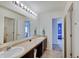 Bathroom with light tile floors, double sink, and large mirror at 951 Gondola Run, Greenfield, IN 46140