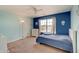 Bright bedroom with an accent wall, window, carpet, ceiling fan, and a twin bed at 951 Gondola Run, Greenfield, IN 46140