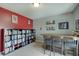 Finished bonus room featuring a large bookcase, a bar, and neutral carpet for versatile use at 951 Gondola Run, Greenfield, IN 46140