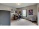 Cozy bonus room with carpeted floors, a bar, and comfortable seating perfect for entertaining at 951 Gondola Run, Greenfield, IN 46140