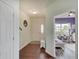 Inviting foyer features hardwood floors, a bench and a view into an adjacent room at 951 Gondola Run, Greenfield, IN 46140