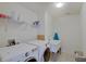 Functional laundry room with washer, dryer, utility sink, and storage shelving at 951 Gondola Run, Greenfield, IN 46140