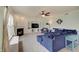 Bright living room with fireplace, large windows, and comfortable blue sectional couch at 951 Gondola Run, Greenfield, IN 46140