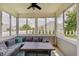 Inviting sunroom with comfortable seating, large windows, and an abundance of natural light at 951 Gondola Run, Greenfield, IN 46140