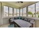 Inviting sunroom with comfortable seating, large windows, and an abundance of natural light at 951 Gondola Run, Greenfield, IN 46140