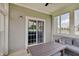 Inviting sunroom with comfortable seating, large windows, and an abundance of natural light at 951 Gondola Run, Greenfield, IN 46140