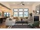 Bright living room boasts large windows, fireplace, and a comfortable seating area with modern decor at Lot 2 Vanderbilt Dr, Anderson, IN 46011