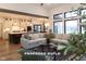 Open-concept living room features large windows, neutral color palette, and seamless flow to the modern kitchen at Lot 2 Vanderbilt Dr, Anderson, IN 46011