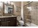 Bathroom features granite counters, dark cabinets, a shower, and neutral tile at 1020 Lair Ct, Westfield, IN 46074