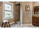 An elegant bathroom featuring a granite countertop, walk-in shower, and a stylish stained-glass window at 1020 Lair Ct, Westfield, IN 46074