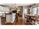 Bright dining room with hardwood floors connecting to the kitchen and living areas at 1020 Lair Ct, Westfield, IN 46074